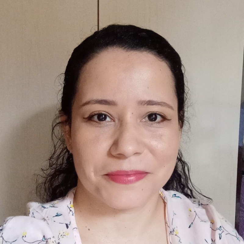 White young woman with blond hair smiling